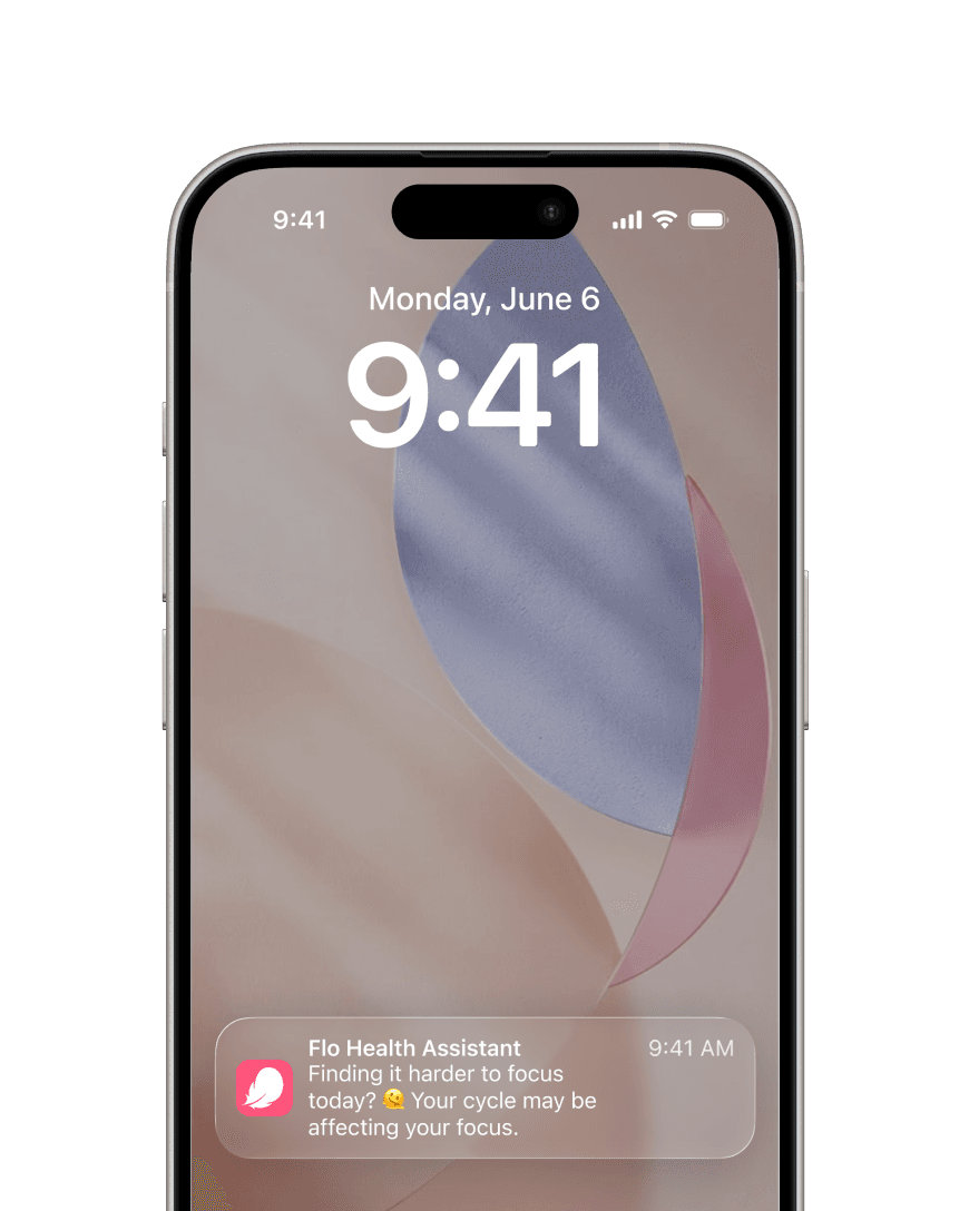 A phone lock screen showing a Flo Health Assistant notification: “Finding it harder to focus today? Your cycle may be affecting your focus.”
